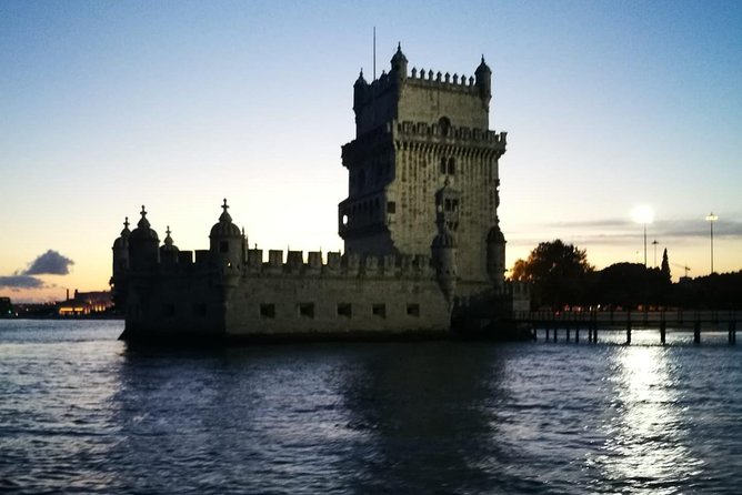 2-Hour Lisbon Traditional Boats Sunset Cruise with White Wine - São Jorge Castle, Alfama, and Lisbon Cathedral from below
