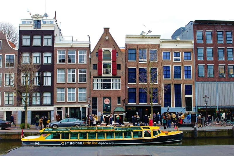 Amsterdam canal cruise with culinary burger or cheese & wine - Maritime sights, NEMO, and Central Station