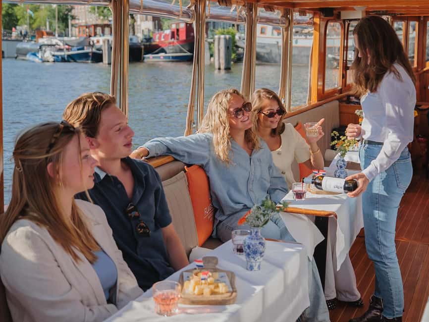 Amsterdam: Classic Saloon Boat Cruise with Cheese & Wine - Why this boat ride feels different from a standard canal tour
