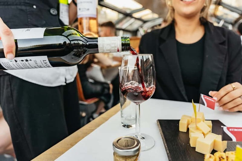 Amsterdam: Cozy Cheese & Wine Cruise Tasting Experience - Amsterdam Centraal and the First Canal Views