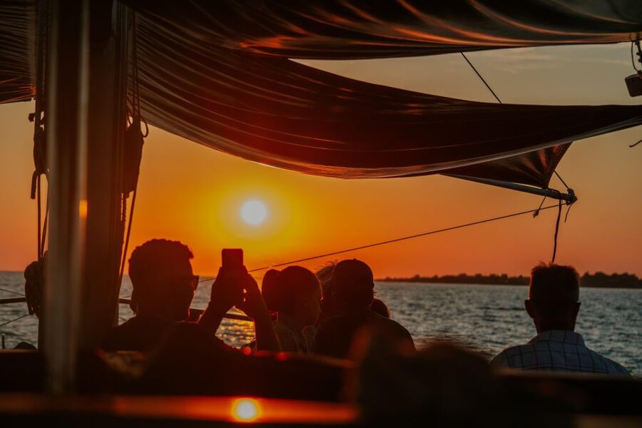 Argostoli: Sunset Cruise with Swim Stops, Dinner, and Wine - Xi Beach and its unusual red sand