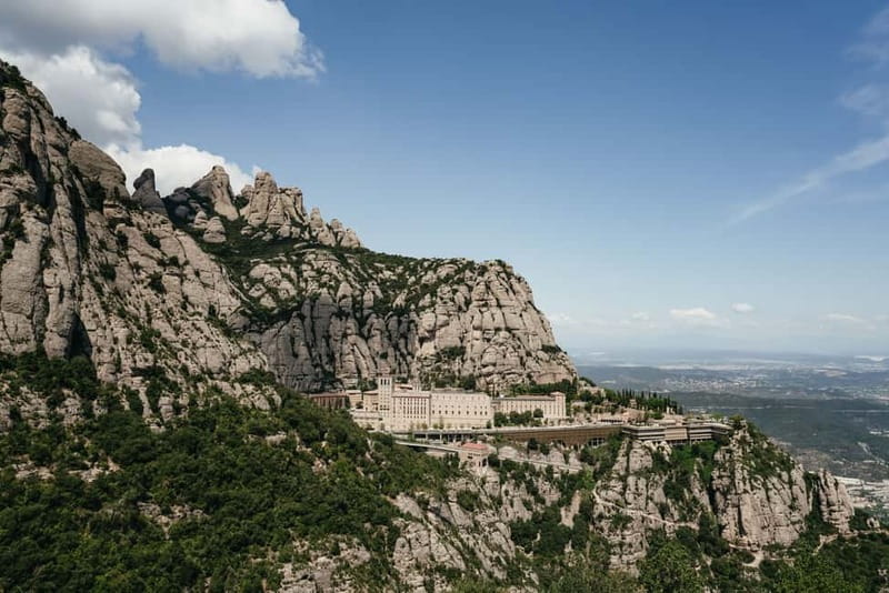 Barcelona: Montserrat, Cogwheel, Black Madonna & Winery Tour - Adding Oller del Mas winery and a Catalan meal