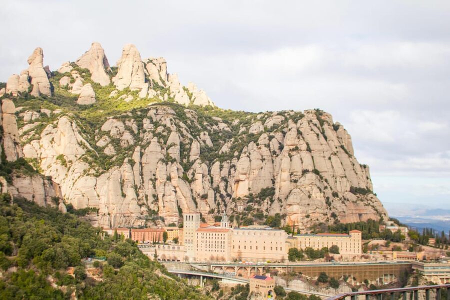 Barcelona: Montserrat, Winery Tour & Lunch with Wine Tasting - Riding the cogwheel train into Montserrat