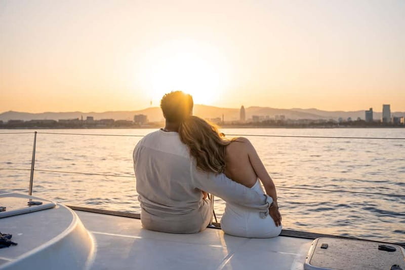 Barcelona: Sunset Catamaran Cruise with Wine and Tapa - Along the Barcelona coast at sunset