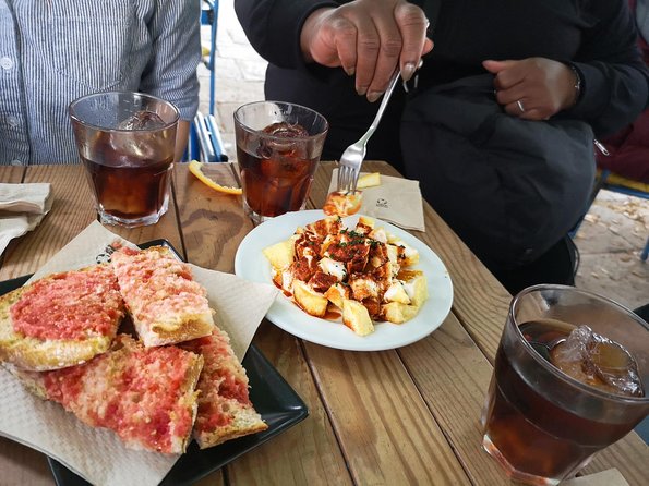 Barcelona Tapas & Wine Private Tour in Traditional Taverns - Stop three: beef, chickpeas, garlic bread, and red wine
