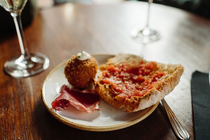 Bohemian Barcelona Neighborhood Evening Tapas & Wine Tour - Bastaix adds Argentine influence and fortified wine