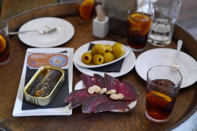 Born to Eat: Gourmet Tapas & Wine Small Group Tour in Old Barcelona - Stop one: rustic aperitifs and the rhythm of local bars