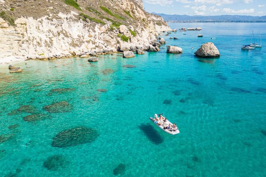 Cagliari: Zodiac Boat Tour, 3-4 SwimStops, Wine & Snorkeling - Cala Fighera brings cliffs, photographs, and fish