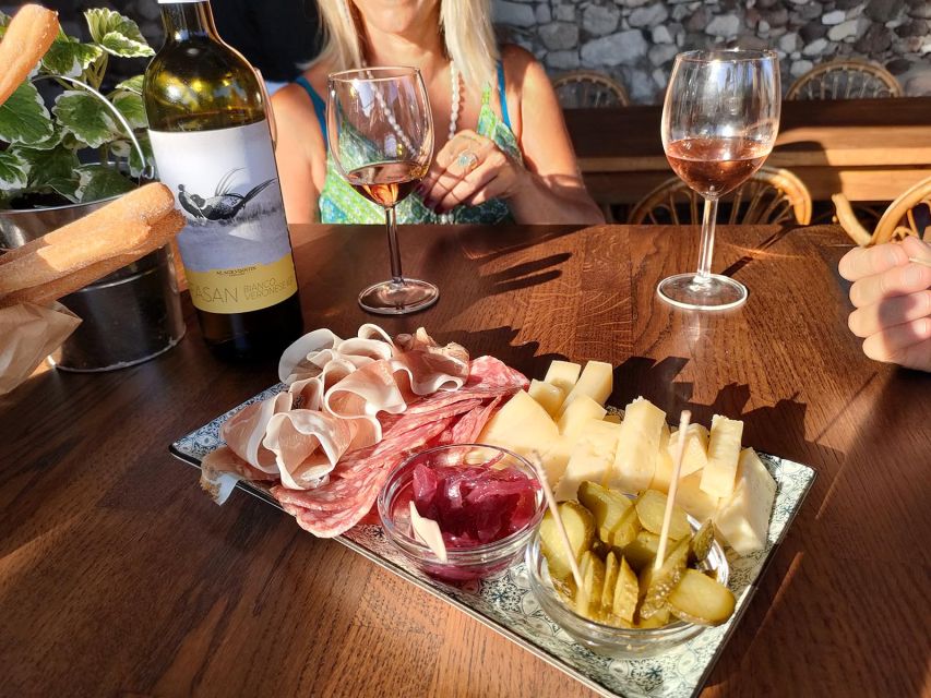 Cavaion: Lake Garda Wine & Food Tasting with Vineyard Tour - A farm shop with olive oil, jams, and grappa