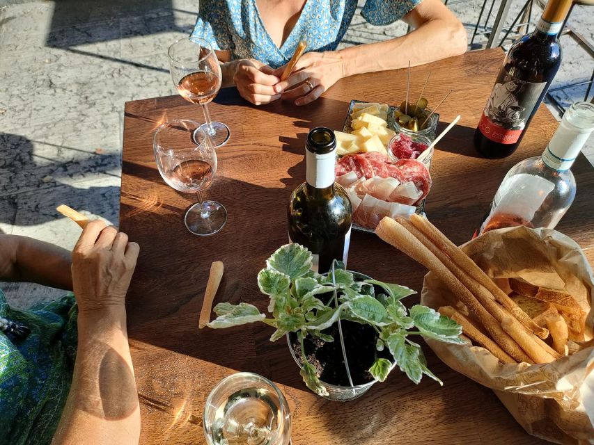 Cavaion: Lake Garda Wine & Food Tasting with Vineyard Tour - Three or five wines under the grape arbor