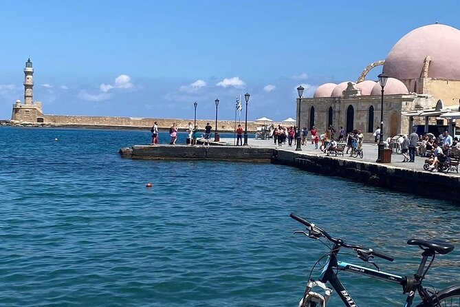Chania Walking Food And Wine Night Tour - Entering the Venetian quarter by the fountain square