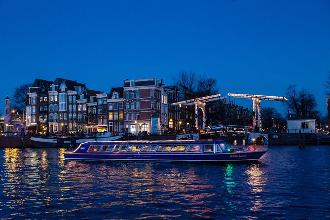 Evening Canal Cruise in Amsterdam with Wine & Cheese Option - Westerkerk, a church tower beside the canals