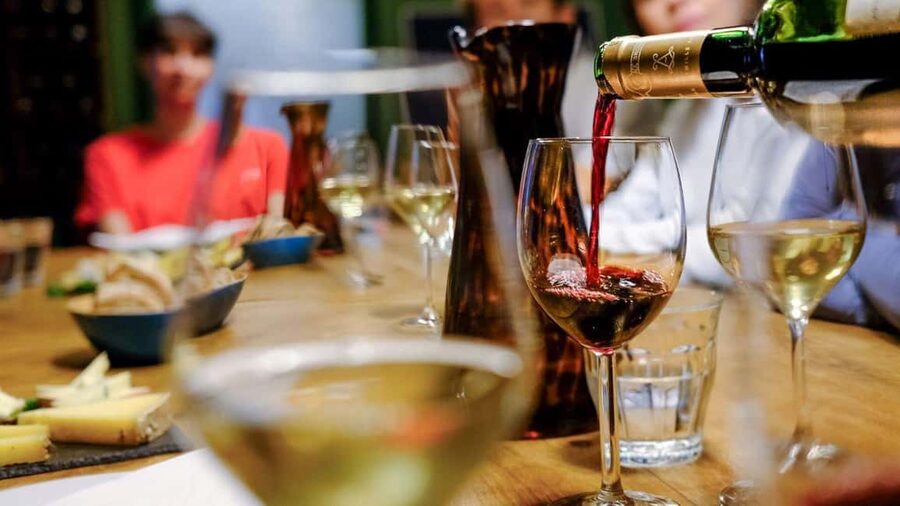 Florence Foodies Tour: Savor Tuscan Flavors & Fine Wine - The final wine window, Tuscan cookies, and Vin Santo