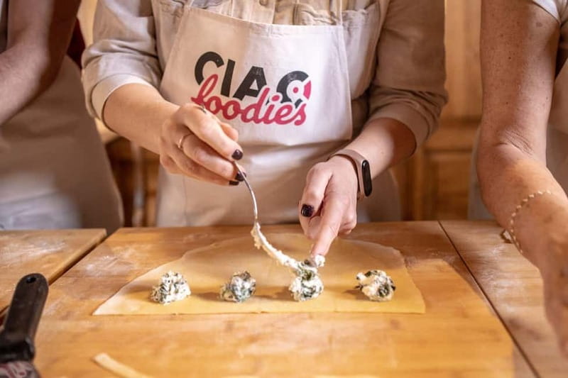 Florence: Pasta & Tiramisu Class with Unlimited Wine - Appetizers, wine, and the shared table