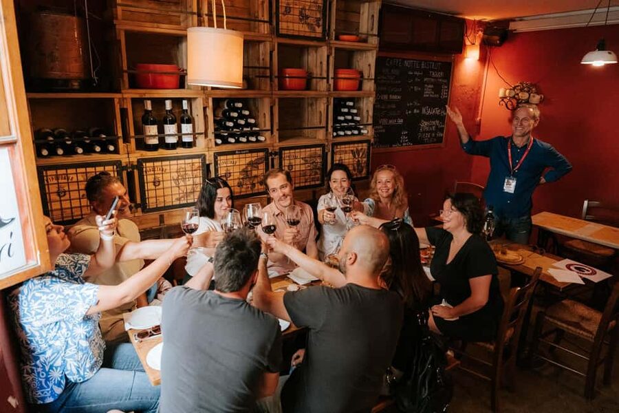 Florence: Small-Group Sunset Food & Wine Tour in Oltrarno - Babae brings in the wine