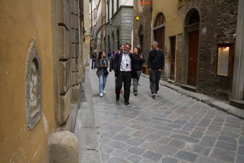 Florence: Wine Windows & Hidden Legends Evening Tour - The wine served through a buchetta