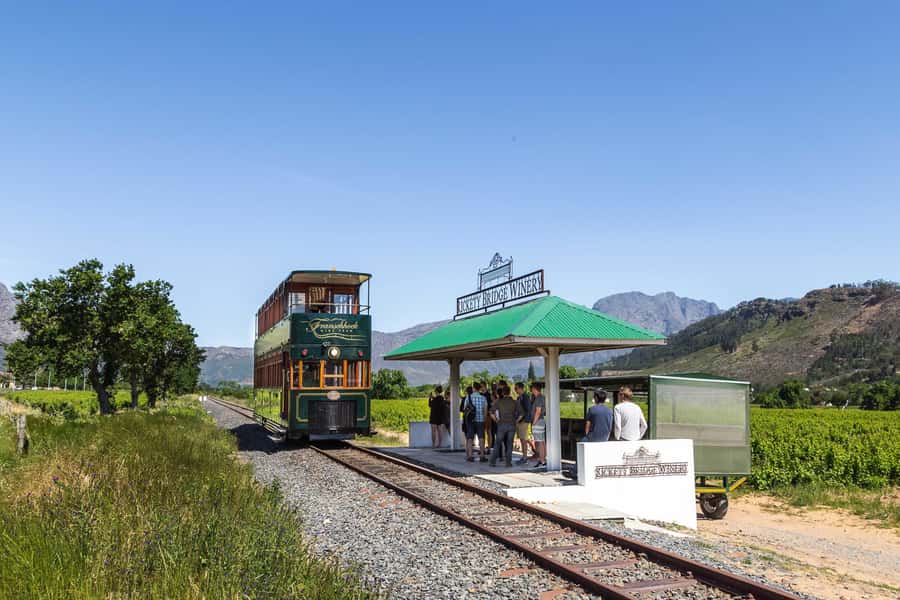 From Cape Town: Franschhoek Wine Tram Hop-on Hop-off - From Cape Town streets to Franschhoek vineyards