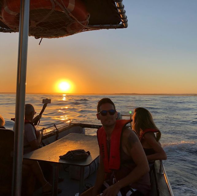 From Portimão: Sunset Boat Trip with Wine - A sunset viewed from the water