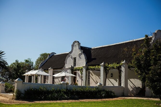 Full Day Small Group Wine Tour Cape Town and Stellenbosch - Simonsig: sparkling wine, sabrage, and local snacks
