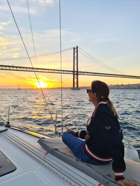 Lisbon: Daytime or Sunset Boat Cruise with History and Wine - The 25 de Abril Bridge and Cristo Rei from the water