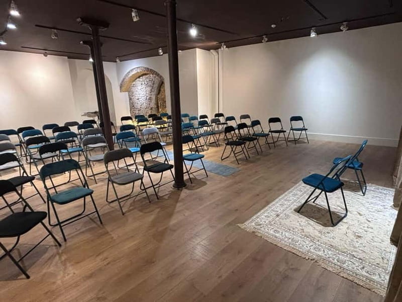 Lisbon: Live Fado Show in Historic Alfama with Port Wine - Inside the intimate performance room