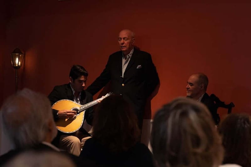 Lisbon: Live Fado Show with Port Wine at Lisboa em Fado - A close view of singers and Portuguese guitars