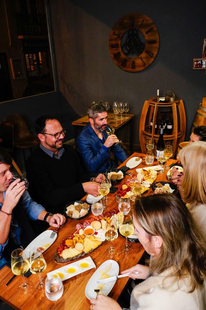 Lisbon: Premium Wine and Tapas Tasting Session - Cheese, sausages, ham, and the famous board