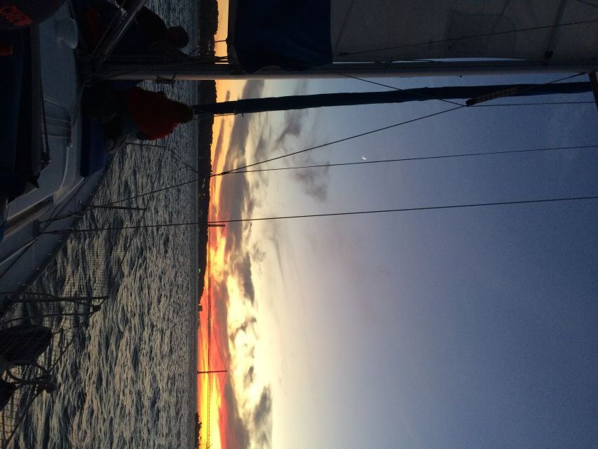 Lisbon: Private Sunset Sailing Tour with Champagne - Returning past central Lisbon at dusk