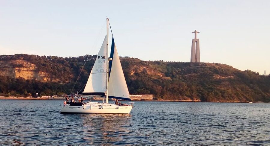 Lisbon: Sailing Tour with Wine and Snacks - Under the 25 de Abril Bridge
