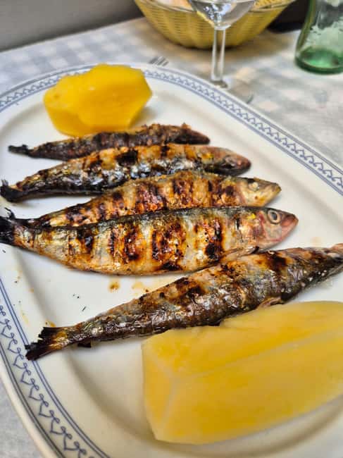 Lisbon Small-Group Food & Wine Tour Eat & Drink like a Local - Starting with cod cake in Lisbon’s oldest tavern