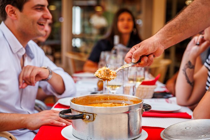 Lisbon Small-Group Portuguese Food and Wine Tour - Rossio Square starts the meal with cod and green wine