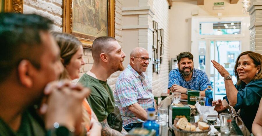 Madrid: Food & Wine Tour with 10 Tapas & 4 Drinks Included - Stop two: a neighborhood bar with Madrid character
