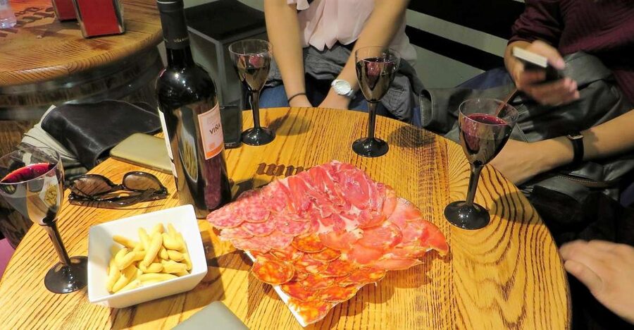 Madrid: Iberico Ham and Spanish Wine Small-Group Food Tour - First lessons: ham, curing and Spanish labels