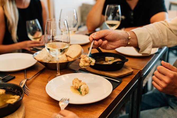 Madrid Tapas & Wine Tour with Rooftop Views and Local Guide - The guides and the feel of the group