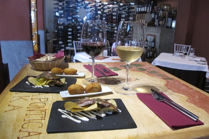 Malaga Wine & Tapas Small Group Guided Tour - Iberian ham and vermouth at an ultramarinos