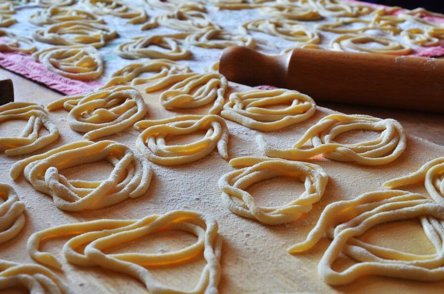Montepulciano: Pasta-Making Class with Tasting and Wine - Tagliatelle, ravioli, and sauces on the table