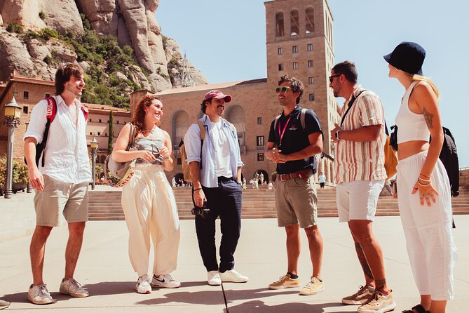 Montserrat Tour with Winery Lunch & Exclusive Cellar Experience - Riding the cogwheel train to Montserrat