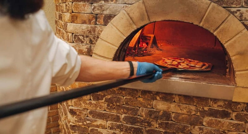 Naples: Premium Pizza Class From Dough to Dessert & Wine - The wood-fired oven and the moment of truth