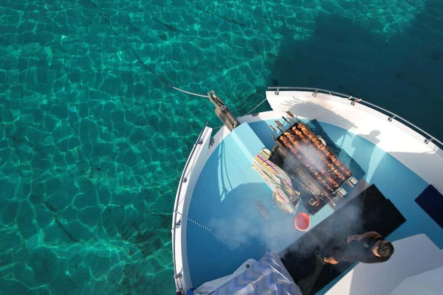 Paphos: Blue Lagoon Afternoon Cruise with Swim, BBQ & Wine - Cruising the Akamas bays by boat