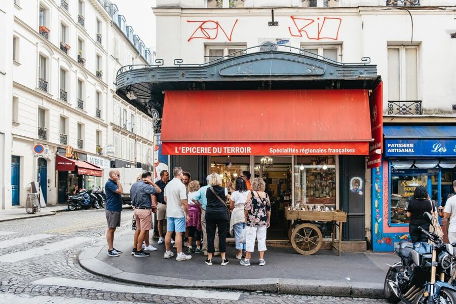 Paris: Montmartre Food and Wine Guided Tour - Macarons, choux à la crème, and chocolate finish the route