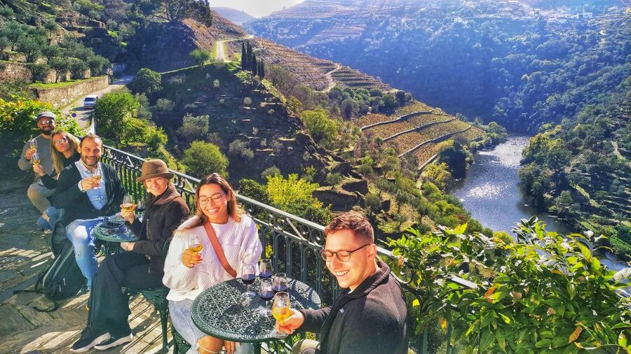 Porto: Douro Valley Wine Tour with Tastings, Boat, and Lunch - A small boat and the Douro from water level