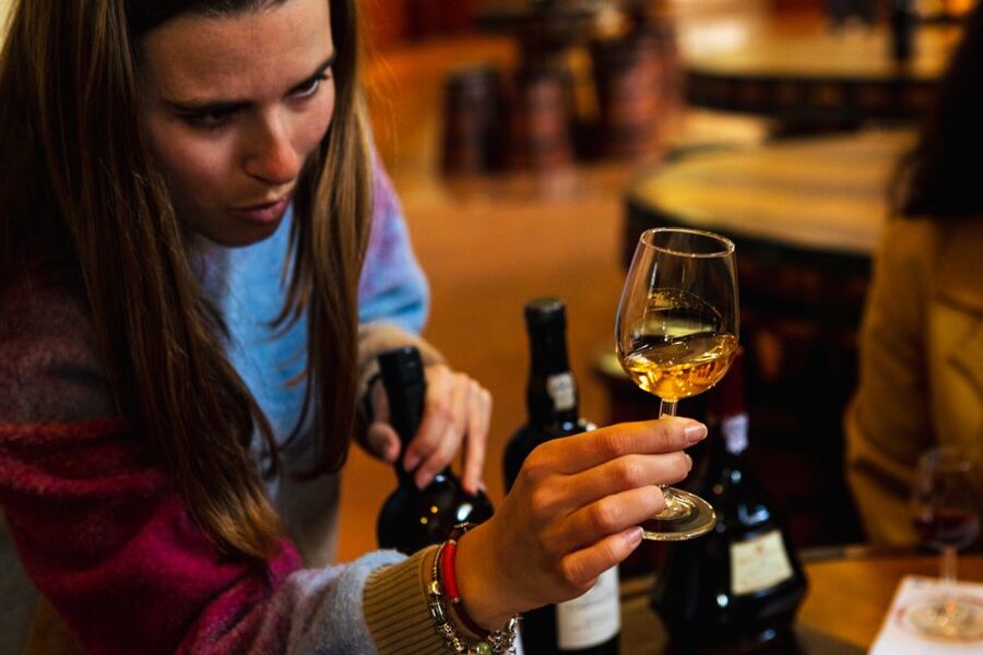 Porto: Food & Wine Tasting Walking Tour with Port Wine Cave - The old Port cellar and three glasses from the Douro
