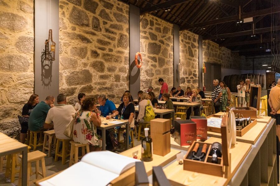 Porto: Guided Tour and Tasting of 3 Port Wines at Poças - Walking through the ageing cellar
