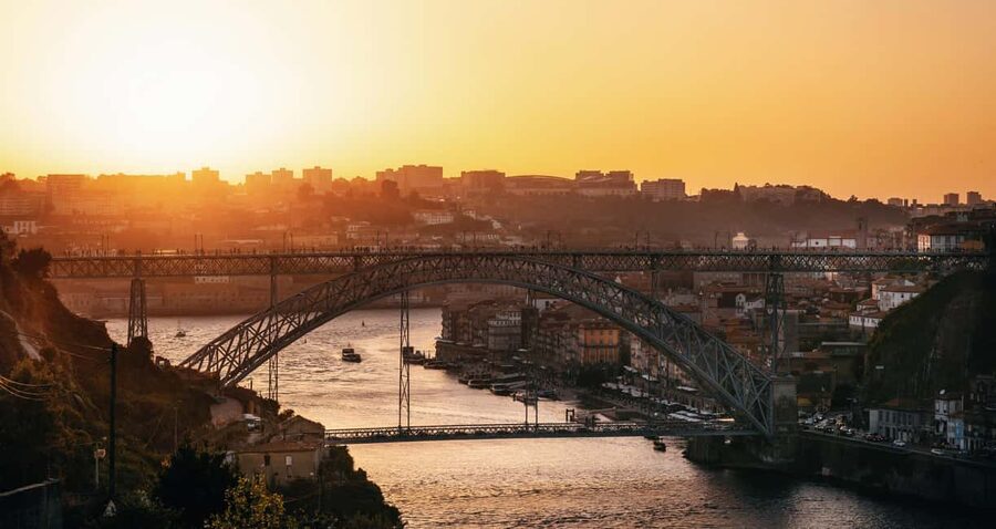 Porto: Sunset Walking Tour with Port Wine and Views - Carmo, Carmelitas, and a clever church detail