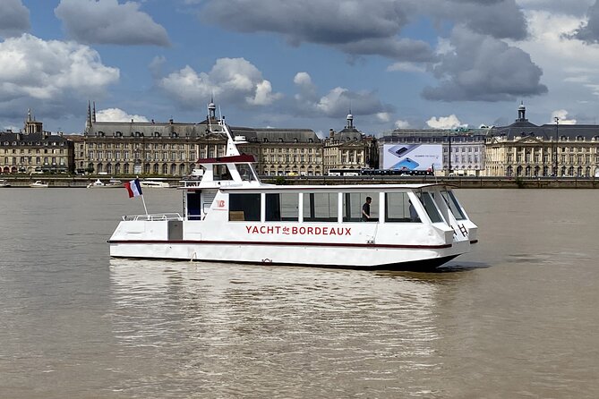 Prestige Commented Cruise glass of wine and Canelé in Bordeaux - A historic gate near the Garonne