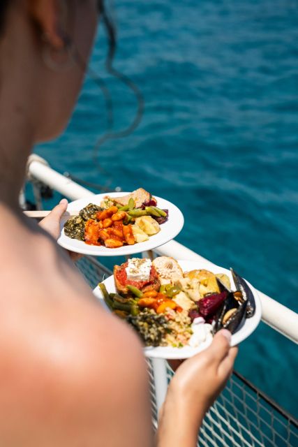 Rhodes: Bay to Bay Swim Cruise with Greek Buffet and Wine - Lunch, wine, and the onboard bar