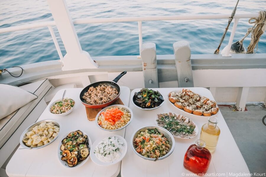 Rhodes: Sunset Cruise with Live Music, Wine & Greek Buffet - Dinner, guitar music, and the sunset at sea
