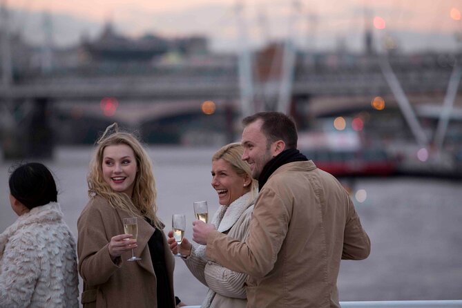River Thames Evening Cruise with Sparkling wine and Canapés - HMS Belfast, Canary Wharf, and the ride back