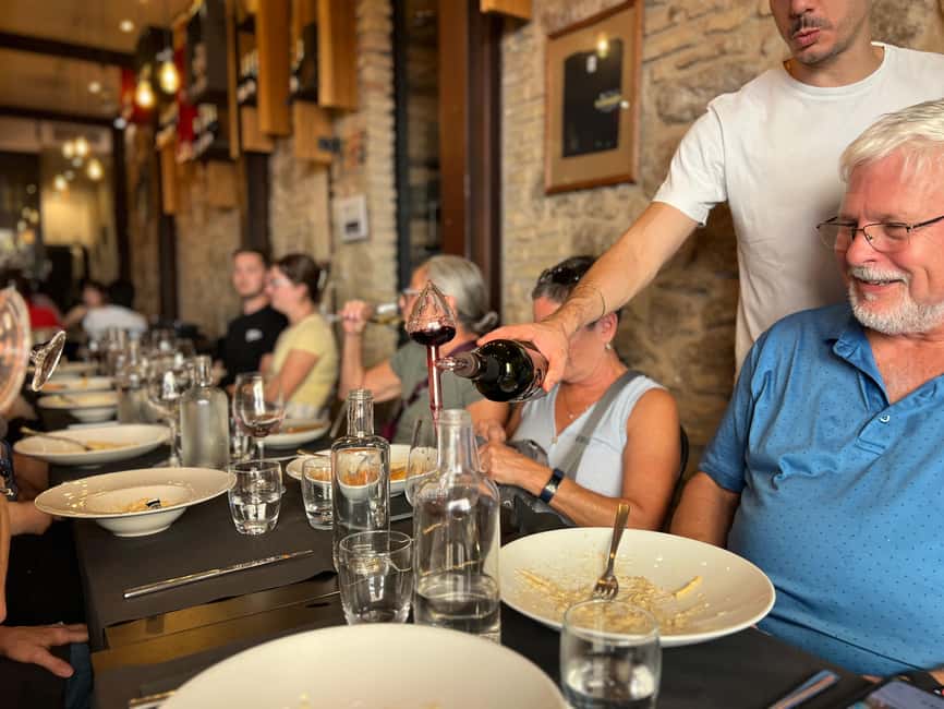 Rome: Gourmet Food Tour with Dinner & Barolo Wine - Il Segreto brings pasta and Barolo