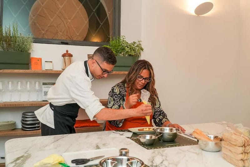 Rome: Hands-On Pasta & Tiramisu Class with Unlimited Wine - Shaping ravioli and choosing the filling